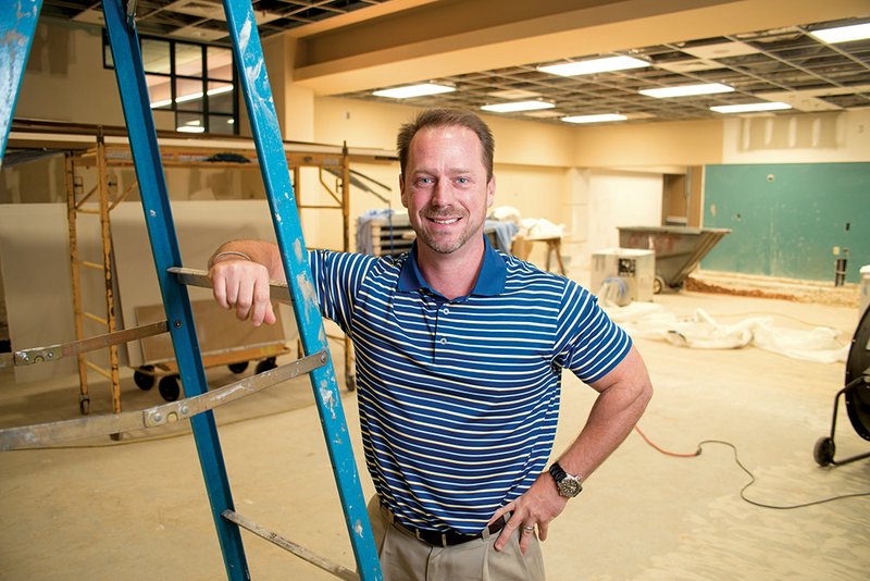 Saline Memorial Foundation Director Matt Brumley stands in the main entrance of Saline Memorial Hospital. The foundation is paying for the remodeling of the facility’s entryway.