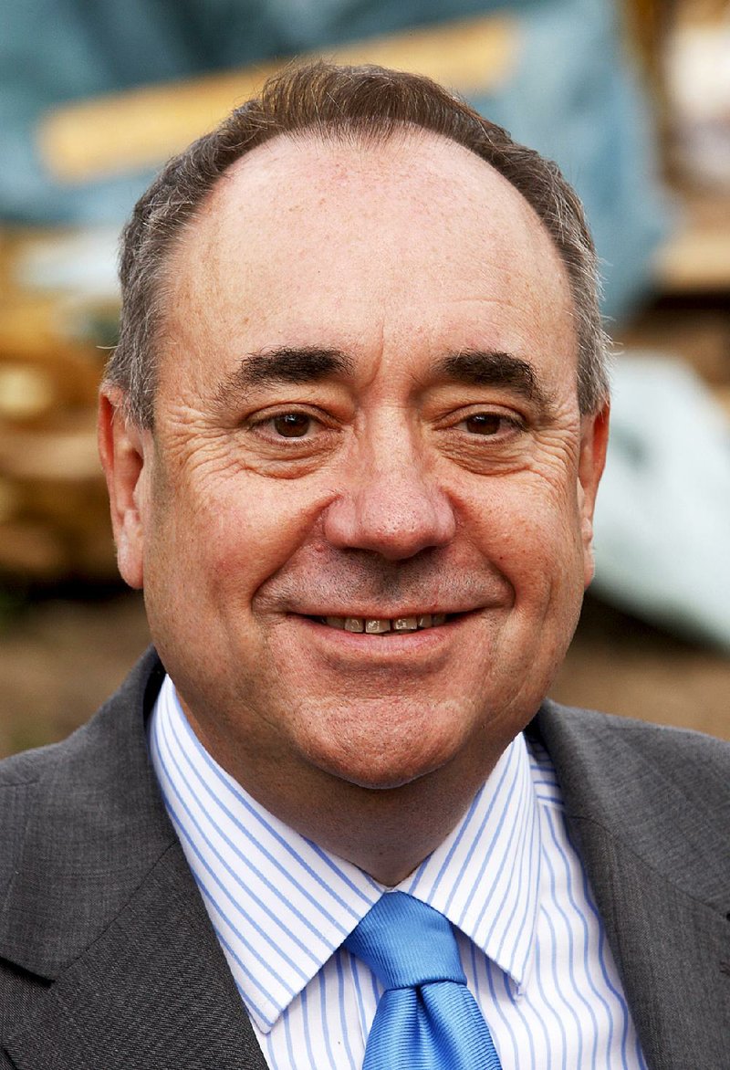 Scottish First Minister Alex Salmond during a visit to a house building project in Arbroath on the East coast of Scotland Monday, Aug. 18, 2014. Two opinion polls show that Scotland's voters are narrowly divided on whether to leave the United Kingdom one month before a referendum. Sunday's published polls both found that a majority of decided voters want Scotland to stay within the UK alongside England, Wales and Northern Ireland. (AP Photo/Martin Cleaver)