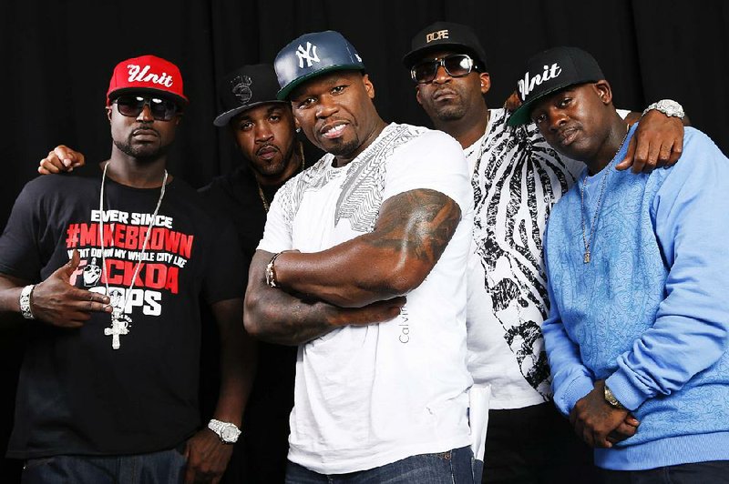 This Aug. 20, 2014 photo shows American rapper, entrepreneur and actor 50 Cent, center, posing for a portrait with G-Unit members Young Buck, Lloyd Banks, Tony Yayo and Kidd Kidd in New York. (Photo by Brian Ach/Invision/AP)