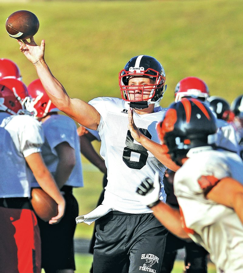 FILE PHOTO BEN GOFF &#8226; @NWABenGoff Seth Brumley, Pea Ridge quarterback, throws a pass July 28 during 7-on-7 scrimmages at a team camp hosted by Gravette in Lions Stadium.