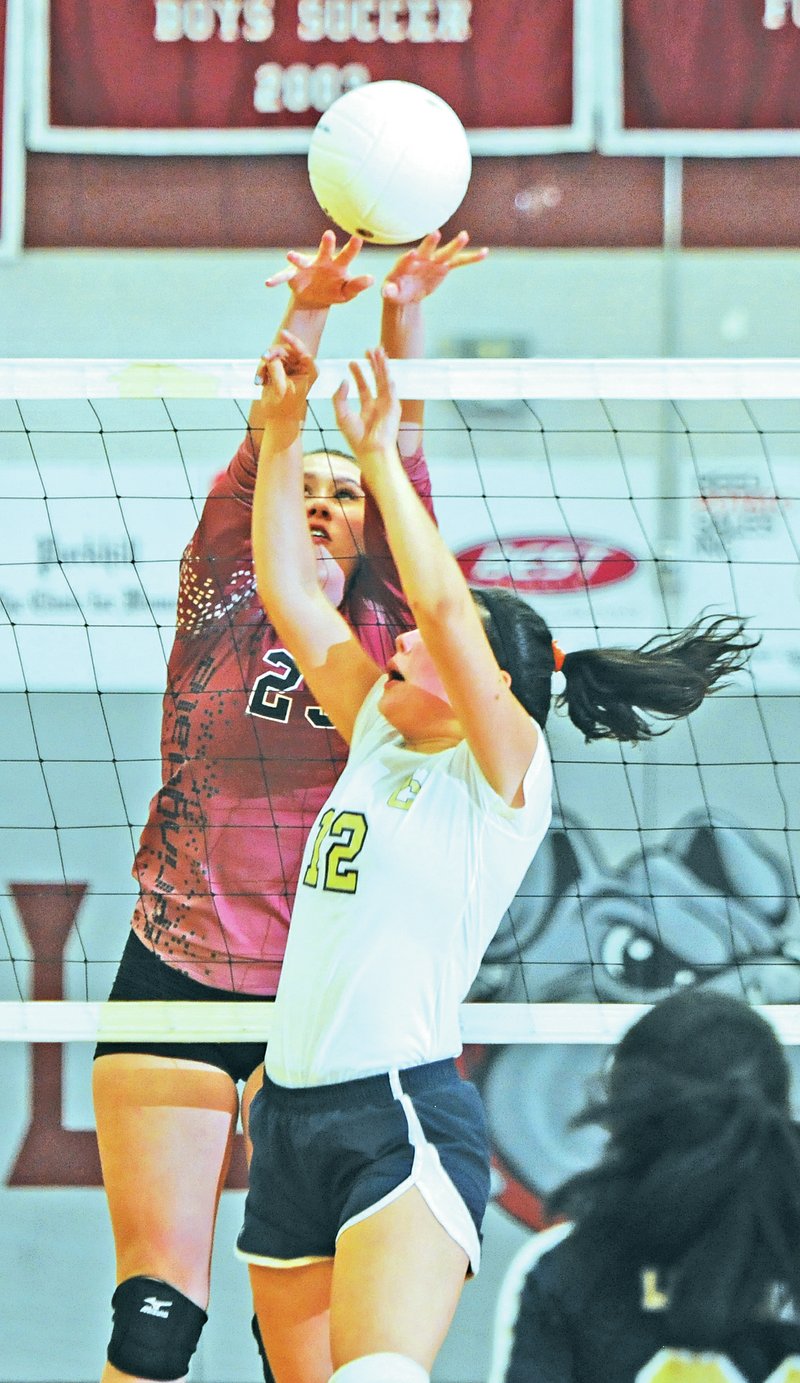 Staff Photo J.T. Wampler Ryann Goodsell of Springdale High hits the ball past Shiloh Christian&#8217;s Hannah Smithson on Monday at the Springdale High gym.