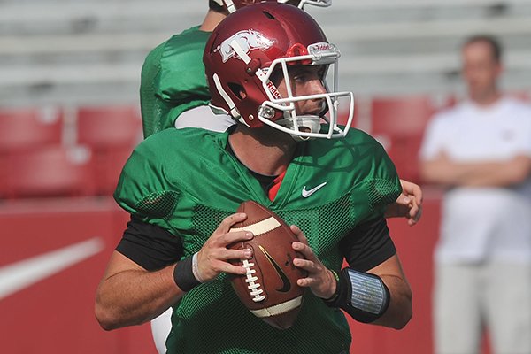 Arkansas quarterback Brandon Allen runs drills during practice on Saturday, Aug. 9, 2014 at Razorback Stadium in Fayetteville. 
