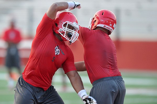 Fort Smith Northside football player Daytrieon Dean runs drills Wednesday evening during practice in Fort Smith.