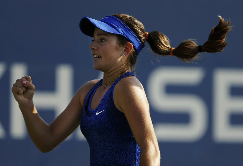 Catherine Bellis, of the United States, reacts after a point against Dominika Cibulkova, of Slovakia, during the first round of the 2014 U.S. Open tennis tournament, Tuesday, Aug. 26, 2014, in New York. (AP Photo/Darron Cummings)