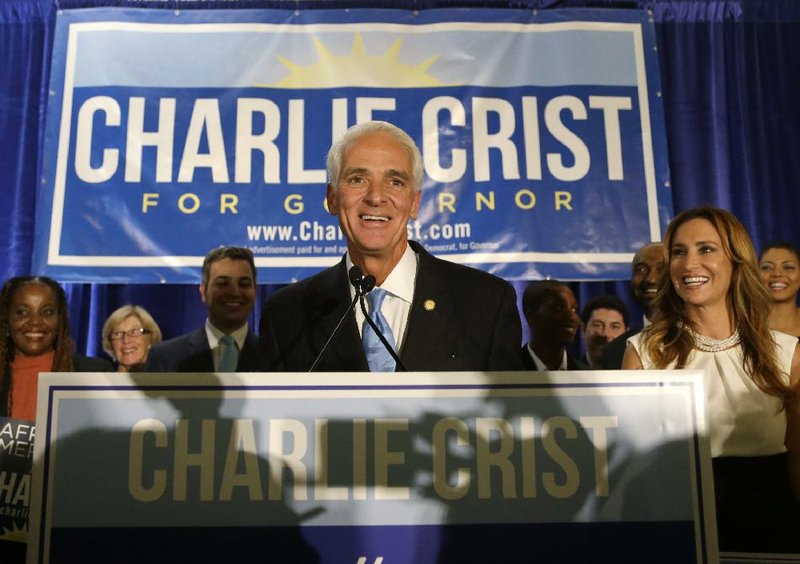 Former Republican Gov. Charlie Crist of Florida addresses supporters Tuesday night at a victory party in Fort Lauderdale after winning the Democratic nomination for governor. He’ll face his successor, Republican Gov. Rick Scott.