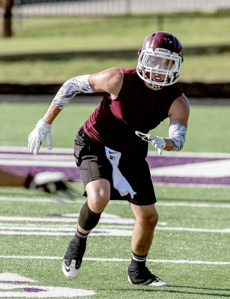 Anthony Reyes/NWA Media Jake Faulkenberry, of Gentry, rushes toward the ball during a 7-on-7 game at Harmon Field in Fayetteville on July 14.