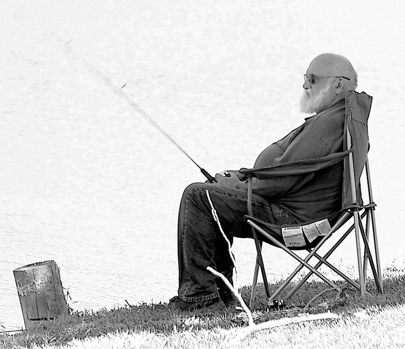 Photo by Randy Moll Richard Doyle, of Sulphur Springs, spent a warm afternoon of fishing at Crystal Lake in Decatur earlier this month.