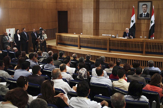 Syrian Foreign Minister Walid al-Moallem speaks during a press conference, giving the first public comments by a senior Assad official on the threat posed by the Islamic State group, in Damascus, Syria on Monday, August 25, 2014. Al-Moallem warned the U.S. not to conduct airstrikes inside Syria against the Islamic State group without Damascus consent, saying any such attack would be considered an aggression. Al-Moallem also said that Syria is ready to work with regional states and the international community amid the onslaught of Islamic militants there and in Iraq, adding that the Syrian government is a crucial partner in the war on terror. 