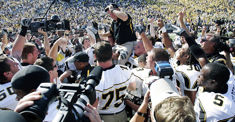 The Associated Press APPALACHIAN TRAIL: Appalachian State coach Jerry Moore is carried by his players off the field at Michigan Stadium after the Mountaineers upended No. 5 Michigan 34-32 in their 2007 season opener in Ann Arbor, Mich. Michigan is opening its 2014 campaign with Appalachian State this week, rekindling flashbacks to the day the Wolverines were on the wrong end of one of the biggest upsets in college football history.