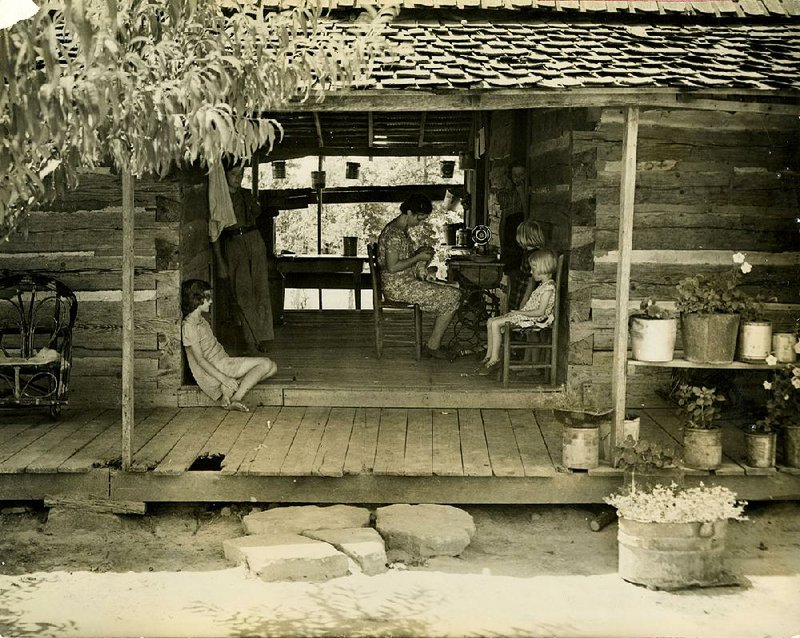 A dogtrot house, with a middle passageway, was designed to keep its occupants as cool as possible during hot days before electric fans and air conditioning. The house in this undated photograph was a few miles from Calico Rock.