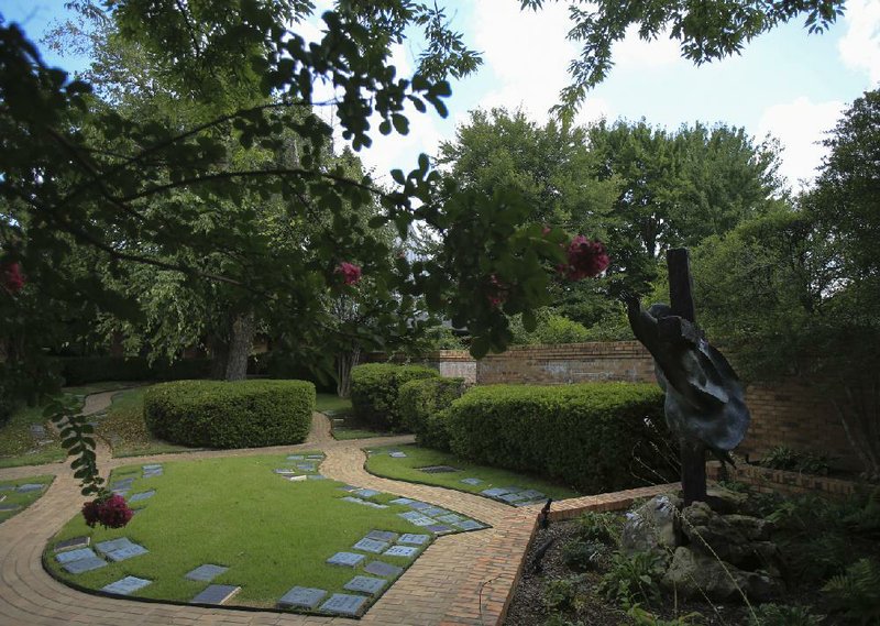  Arkansas Democrat-Gazette/STATON BREIDENTHAL --8/26/14-- The  columbarium garden at St. Mark's Episcopal Church provides a sacred spot for cremated remains. 