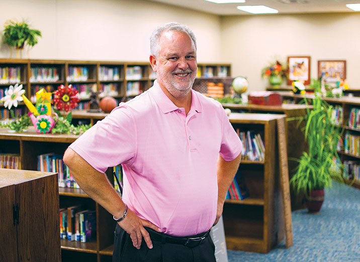 Principal Hal Ward stands in the library of the new section of Clinton Elementary/Intermediate School. Kindergarten through the third grade has a two-story facility, which was completed this summer. Students previously had to leave the building to use the library. Students in kindergarten through the sixth grade share the new library.