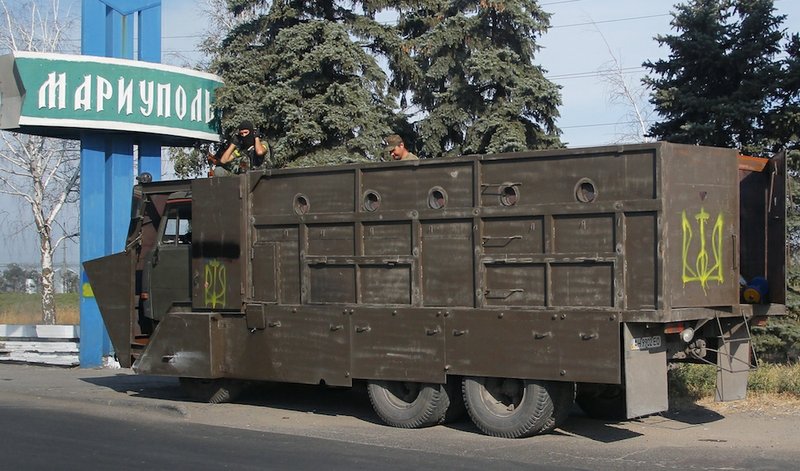 Armored truck with Ukrainian forces guard at a checkpoint in the town of Mariupol, eastern Ukraine, on Thursday, Aug. 28, 2014. Ukraine's President Petro Poroshenko called an emergency meeting of the nation's security council and canceled a foreign trip Thursday, declaring that "Russian forces have entered Ukraine," as concerns grew about the opening of a new front in the conflict. 