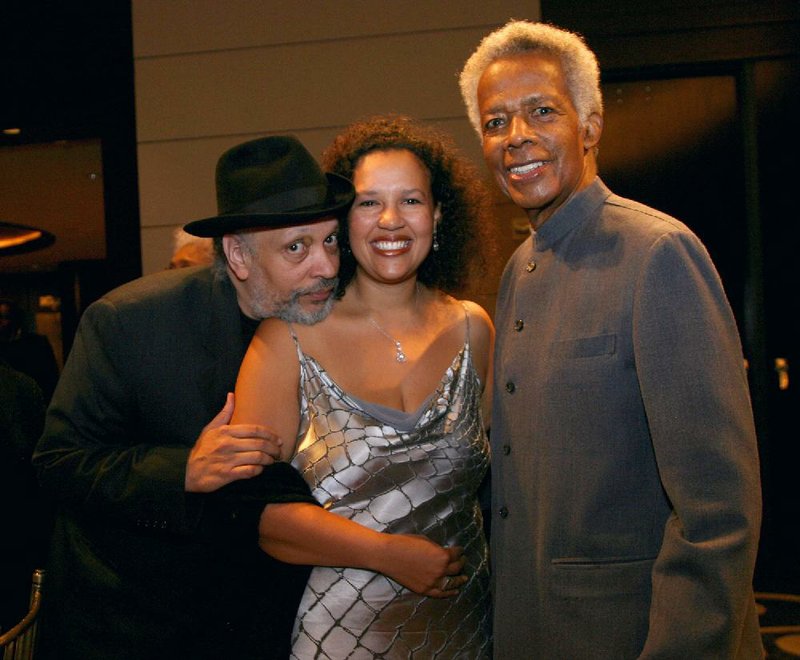FILE- In this Oct. 6, 2006 file photo, author Walter Mosely, left, Elinor R. Tatum, publisher and editor-in-chief of the Amsterdam News, center, and documentary filmmaker William Greaves  attend the 80th anniversary celebration of Harlem's Schomburg Center at Jazz at Lincoln Center in New York. Greaves, the Emmy-award winning producer and co-host of the groundbreaking "Black Journal" and a prolific and adventurous filmmaker whose subjects ranged from Muhammad Ali to the Harlem Renaissance to the black middle class, has died. He was 87. (AP Photo/Rick Maiman, file)