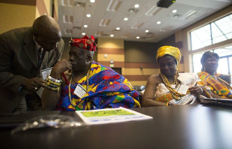 Arkansas Democrat-Gazette/MELISSA SUE GERRITS - 08/28/2014 - Alderman James Bolden from Jacksonville, leans in to speak to Paramount King Togbe Dagadu VIII, representing traditional rule from Ghana before he and (left and right of Togbe) Mama Komla Teng III the Queen Mother of Kpando and Women's Leader Kuada Yawa of the North Dayia District, speak on a panel discussion about culture and agriculture August 28, 2014. The delegates met at the Arkansas Municipal League Building with representatives of their sister city, Harrison, to discuss further relations and learn about one another's culture and agricultural practices. 