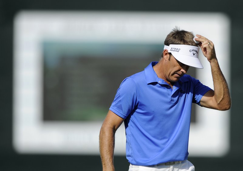 In this June 28, 2014, file photo, Stuart Appleby, of Australia, taps the ball on his head after he putted on the 18th green during the third round of the Quicken Loans National golf tournament in Bethesda, Md. Stuart Appleby is an example of how one week can change everything in the FedEx Cup playoffs. One week he was on the verge of his season being over. Now he's looking at going to all the majors for the first time in five years.