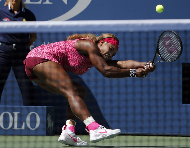 Serena Williams, of the United States, follows through as she returns a shot during the second round of the 2014 U.S. Open tennis tournament, Thursday, Aug. 28, 2014, in New York.