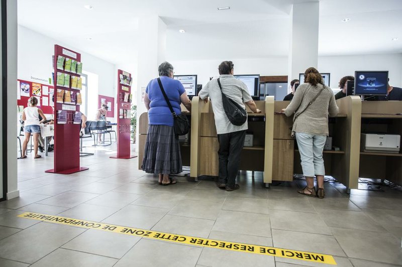 Job seekers stand at computer terminals inside a job center Thursday in Cahors, France. Unemployment in the eurozone in July was 11.5 percent, the European Union’s statistics agency said Friday.