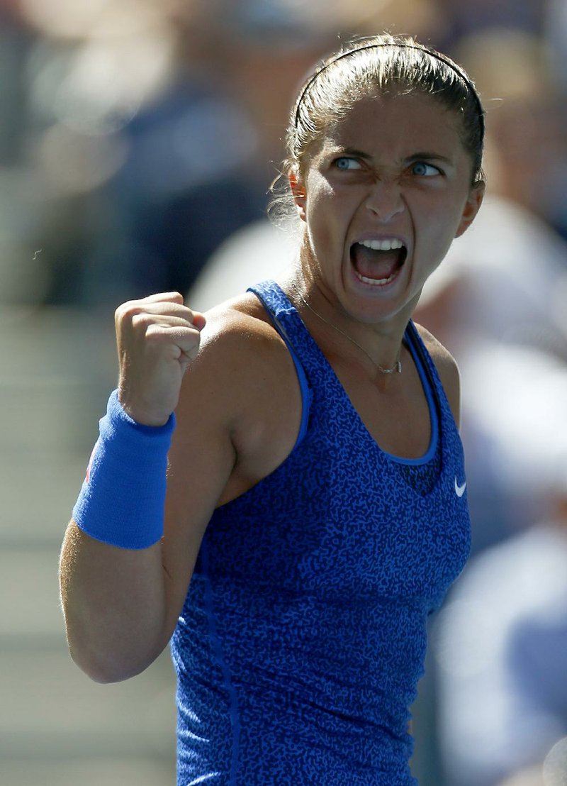 Italian Sara Errani (shown) celebrates during her third-round match against American Venus Williams  on Friday at the U.S. Open in New York. Errani defeated Williams 6-0, 0-6, 7-6 (5) after Williams had a chance to serve out the match in the final set. Williams made 52 unforced errors in the match.