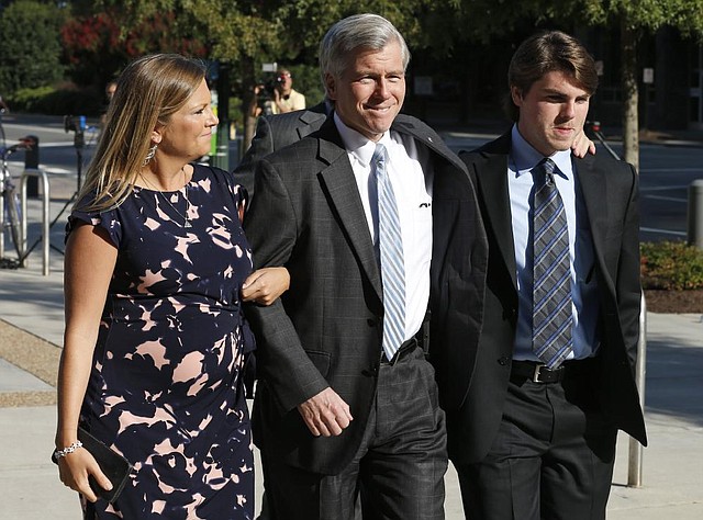 Former Virginia Gov. Bob McDonnell, center, arrives at federal court with his daughter Jeanine McDonnell Zubowsky, left, and son Bobby, McDonnell, right,  Friday, Aug. 29, 2014, in Richmond, Va.  Closing arguments are expected to begin Friday in the McDonnell's corruption case.  (AP Photo/Steve Helber)