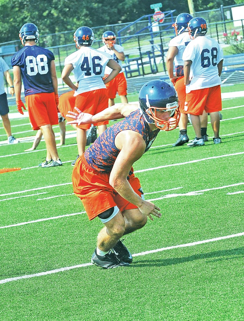FILE PHOTO FLIP PUTTHOFF Tyler Thompson of Rogers Heritage goes through an agility drill Aug. 5 during practice.