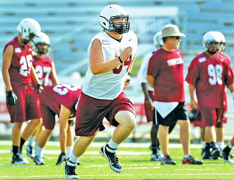 FILE PHOTO JASON IVESTER Kaleb Wade, Springdale High senior offensive lineman, practices Aug. 6 at Jarrell Williams Bulldog Stadium.