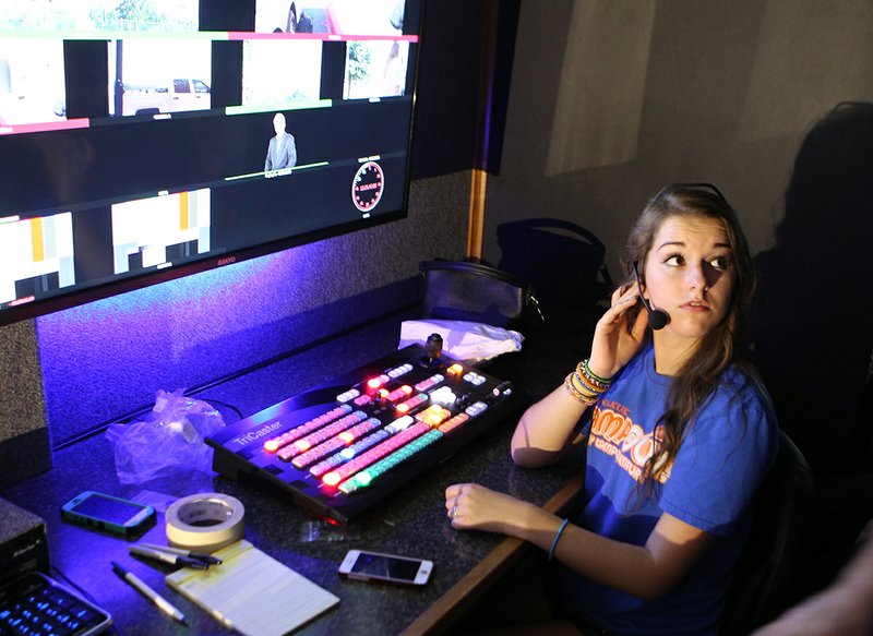 The Sentinel-Record/Richard Rasmussen HANDS-ON: Maggie Trieschmann, a broadcasting student at Lakeside High School, learns about the technology Tuesday in the school&#8217;s new mobile production trailer.