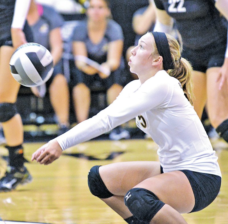  STAFF PHOTO BEN GOFF &#8226; @NWABenGoff Savannah King, Bentonville libero, makes a dig during the non-conference match Aug. 26 against Siloam Springs in Bentonville&#8217;s Tiger Arena.