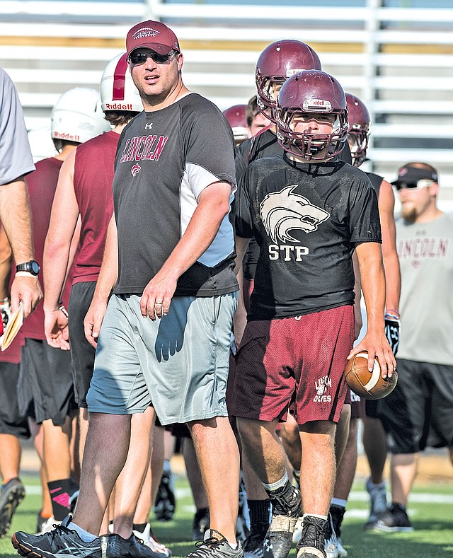  FILE PHOTO ANTHONY REYES Scott Davenport, Lincoln head football coach, watches his team July 7 during a 7-on-7 scrimmage at Springdale Har-Ber in Springdale.