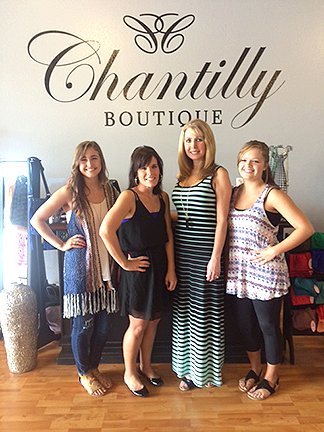 Submitted photo ECLECTIC MIX: Katie Chandler, left, Julie Boley, owner Misty Burroughs, and Jordan Lee model some of the apparel available at Chantilly Boutique.