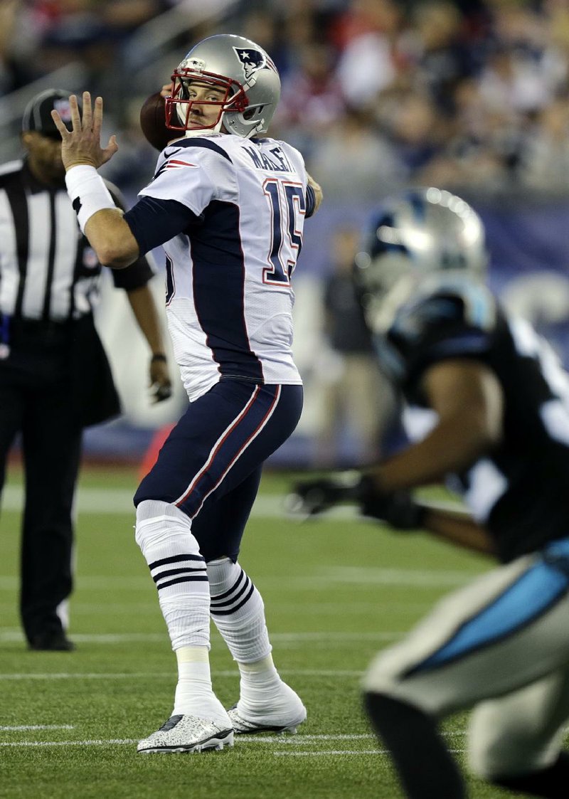 New England Patriots quarterback Ryan Mallett looks for a receiver against the Carolina Panthers in the first half of an NFL preseason football game Friday, Aug. 22, 2014, in Foxborough, Mass. (AP Photo/Charles Krupa) 