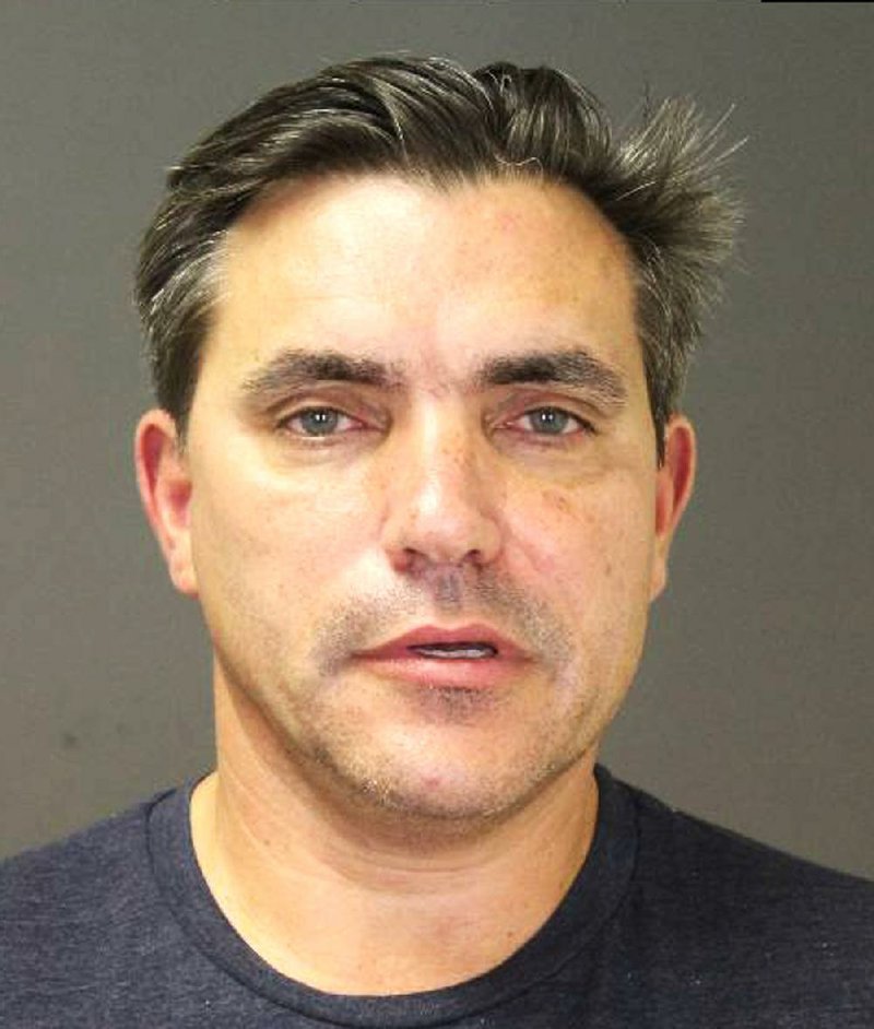 CORRECTS AGE TO 54 This photo provided by the Southampton Town Police Department on Long Island shows celebrity chef Todd English, 54, after his arrest early Sunday morning, Aug 31, 2014 in Southampton, N.Y., where he was charged with driving while intoxicated. English has opened a number of restaurants around the country, including Olives, Figs, and Fish Club. He's also been a regular on television programs including "Iron Chef USA." Authorities say he posted $1,500 bail at Southampton Town Justice Court. (AP Photo/Southampton Town Police Department)