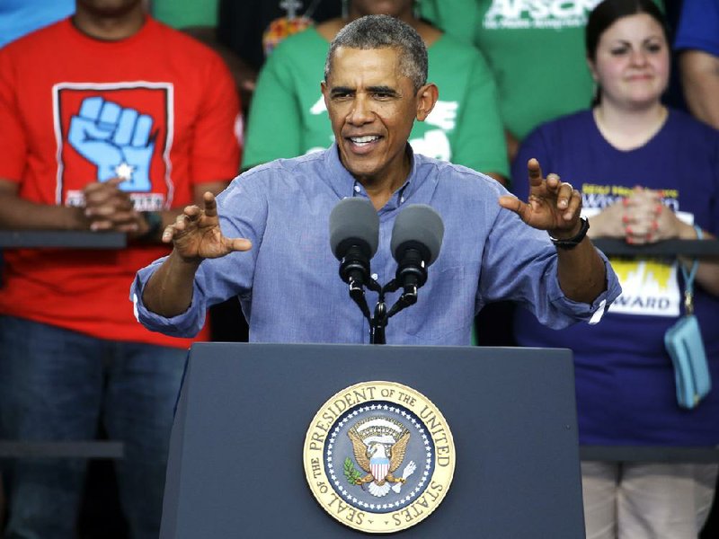 President Obama speaks at Laborfest 2014 at Henry Maier Festival Park Monday, Sept. 1, 2014, in Milwaukee. Obama renewed his call for an increase in the minimum wage.  (AP Photo/Morry Gash)