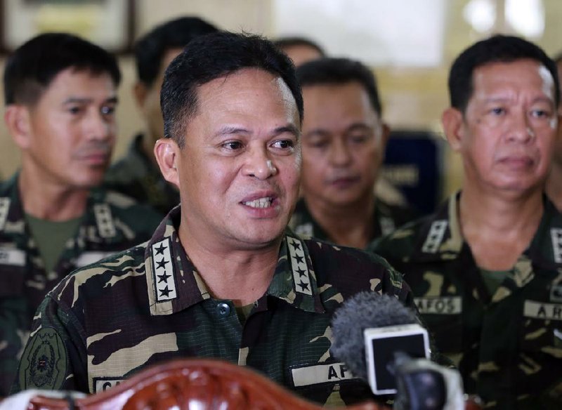Philippine military chief Gen. Gregorio Pio Catapang answers questions from reporters about the situation of Filipino peacekeepers in Golan Heights, during a press conference at Camp Aguinaldo military headquarters in suburban Quezon city, Philippines on Sunday Aug. 31, 2014.Catapang said more than 70 Filipino peacekeepers have escaped from two areas in the Golan Heights that came under attack by Syrian rebels.  (AP Photo/Aaron Favila)