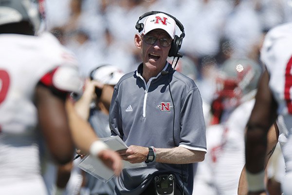 Nicholls State head coach Charlie Stubbs, center, directs his players against Air Force in the second quarter of an NCAA college football game at Air Force Academy, Colo., on Saturday, Aug. 30, 2014. (AP Photo/David Zalubowski)