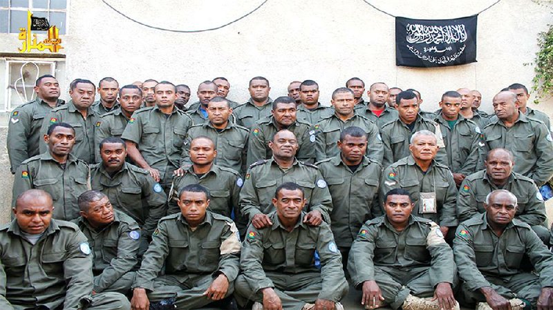 This photo released Saturday on the militant Hanin Network website shows Fijian members of a U.N. peacekeeping force who were seized Thursday by the Nusra Front in the Golan Heights area near Syria’s border with Israel.