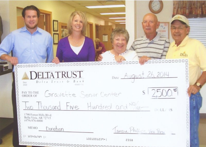 Submitted Photo Delta Trust and Bank presented a check in the amount of $2,500 to the Billy V. Hall Senior Activity and Wellness Center on Tuesday, Aug. 26. The donation will help provide meals for the Meals on Wheels program which serves Gravette, Sulphur Springs, Decatur, Hiwasse and Maysville. The Billy V. Hall Senior Center expressed thanks to Delta Trust and Bank for its continued support. Pictured, from left to right, are John Howell, NWA market president; Tamara Phillips, vice-president, NWA regional retail manager; Mary Kay Kelley, Billy V. Hall Senior Center director; Richard Beck and Al Yanik, advisory council members.