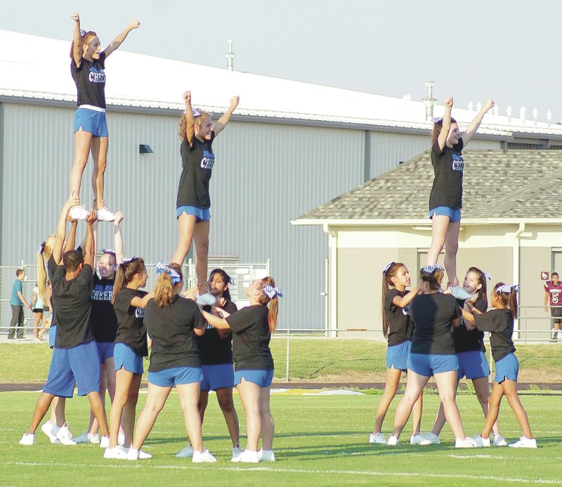 Photo by Randy Moll Decatur&#8217;s cheerleaders perform for fans during Thursday&#8217;s scrimmage game against Gentry in Pioneer Stadium.