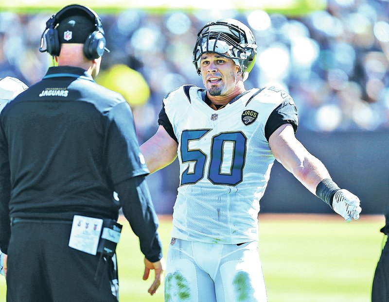 File Photo In this Sept. 15, 2013, file photo, Jacksonville Jaguars outside linebacker Russell Allen (50) talks with coaches during an NFL football game against the Oakland Raiders in Oakland, Calif. Former Jaguars linebacker Allen retired after suffering a concussion and a stroke in a game last December.