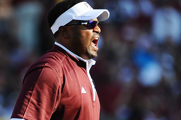 Texas A&M head coach Kevin Sumlin gives instructions to players during the first half of an NCAA college football game against South Carolina, Thursday, Aug. 28, 2014, in Columbia, S.C. (AP Photo/Rainier Ehrhardt)