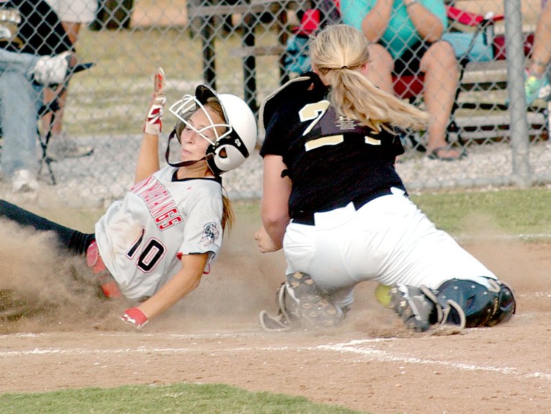 RICK PECK MCDONALD COUNTY PRESS McDonald County&#8217;s Coley Ickes beats a throw to the plate for one of the Lady Mustangs 11 runs in the Lady Mustangs 11-1 win Aug. 28 over Neosho at MCHS.