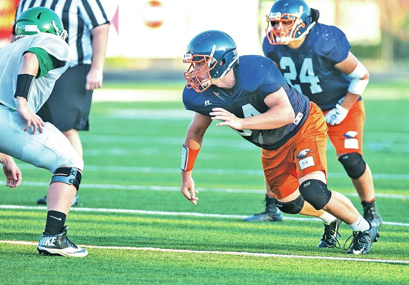 FILE PHOTO ANTHONY REYES &#8226; @NWATONYR Collin Gorman, Rogers Heritage senior, pops off the line as the ball is snapped Aug. 26 against Van Buren during a scrimmage at Gates Stadium in Rogers.