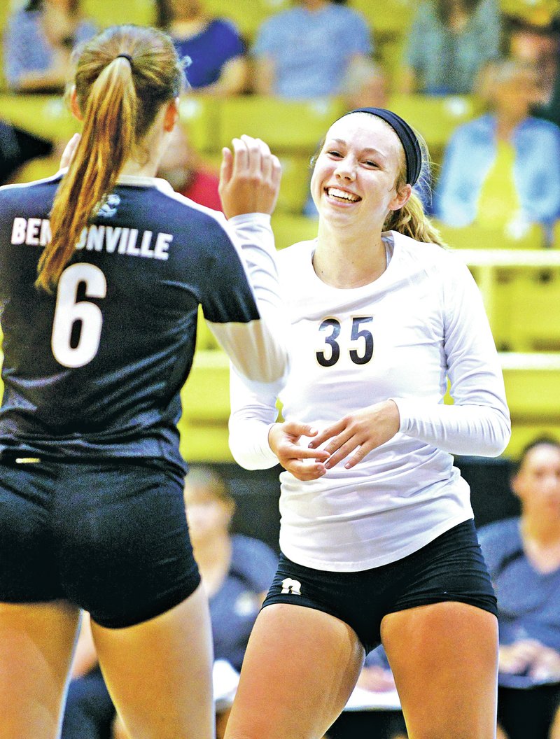 FILE PHOTO BEN GOFF &#8226; @NWABenGoff Savannah King, right, Bentonville libero, celebrates a point Aug. 26 with teammate Ashton Tate during a nonconference match against Siloam Springs at Tiger Arena in Bentonville.