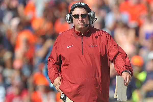 Arkansas coach Bret Bielema walks the sideline during a game Saturday, Aug. 30, 2014 at Jordan-Hare Stadium in Auburn, Ala. 