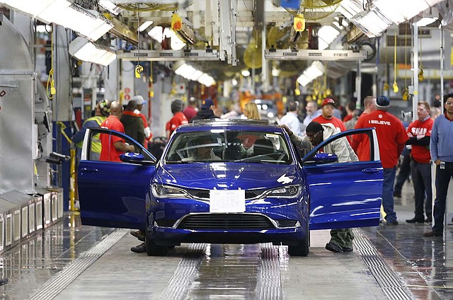 A Chrysler 200 moves down the line at the Sterling Heights, Mich., assembly plant in March. Chrysler Group LLC on Wednesday reported its best August for U.S. vehicle deliveries in 12 years.