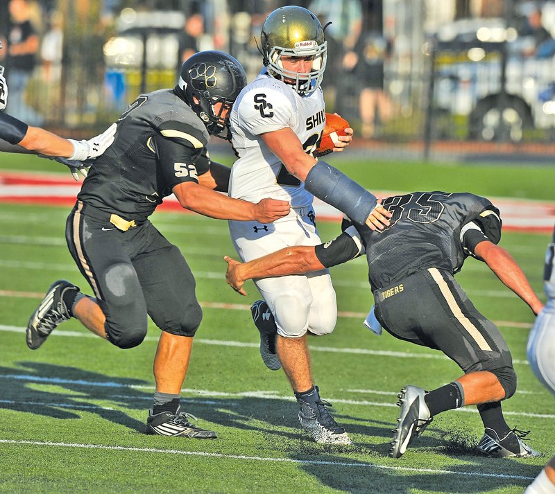  Staff Photo Michael Woods &#8226; @NWAMICHAELW Kyle Freeman, Shiloh Christian running back, tries to get past Charleston defenders during Thursday&#8217;s game at Mayo-Thompson Stadium in Fort Smith.