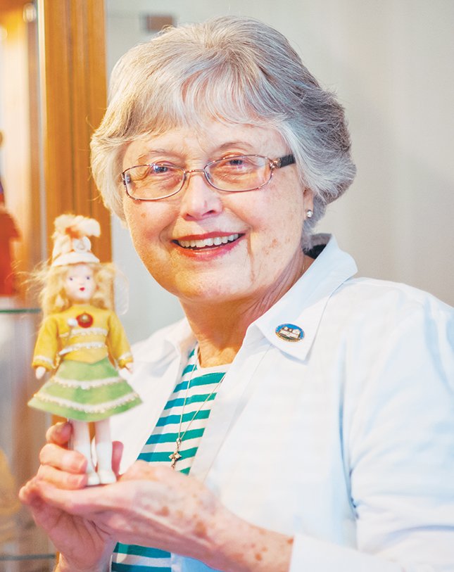 Janis West, one of the founders of the Hot Spring County Museum in Malvern, holds one of the dolls she personally provided for a display at the museum. A celebration for the 33rd anniversary of the museum will take place Thursday, with an open house held from 3-6 p.m.