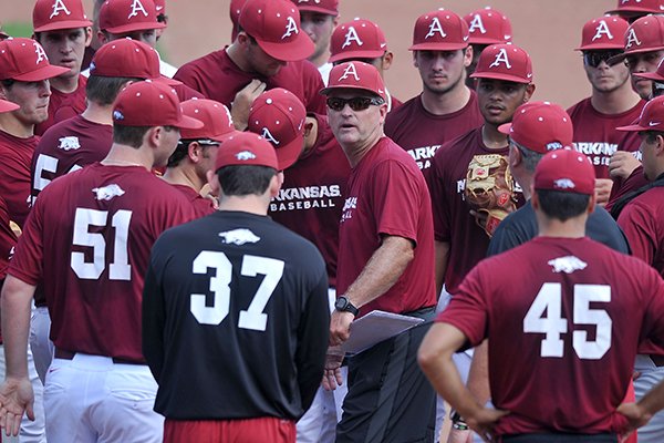 Arkansas coach Dave Van Horn talks with players prior to practice Friday, Sept. 5, 2014 at Baum Stadium in Fayetteville. 