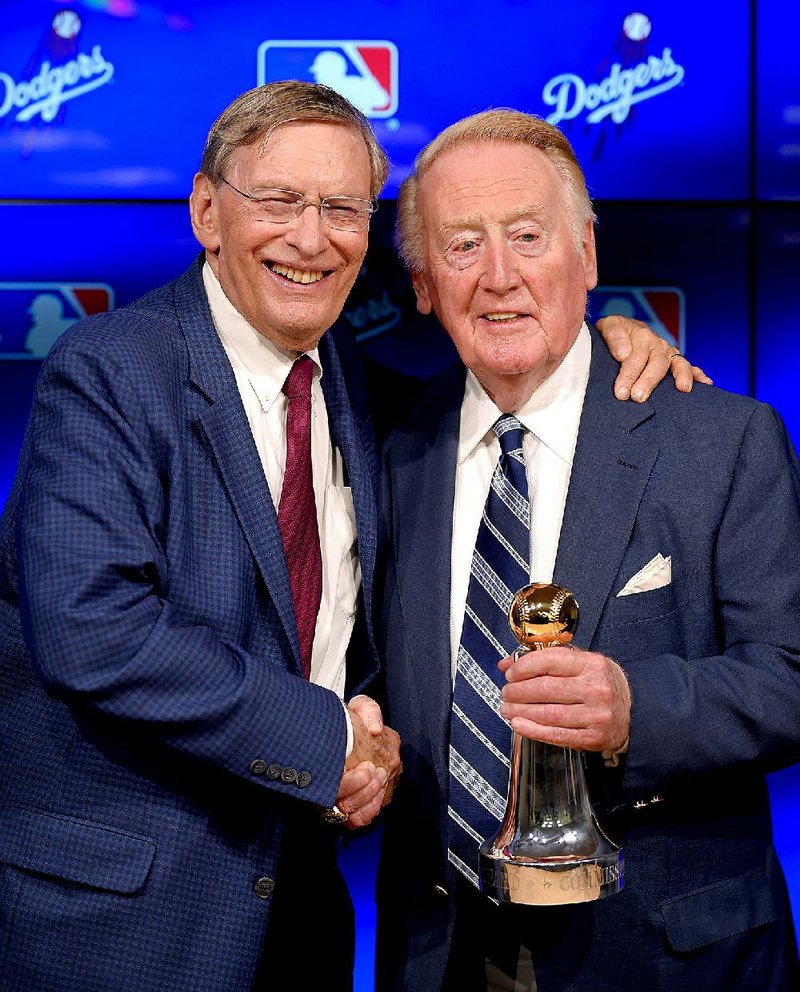 Los Angeles Dodgers broadcaster Vin Scully (right) has many fans among the Dodgers and their opponents, including Washington Nationals pitcher Drew Storen.
