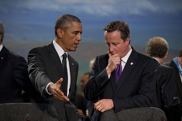 President Barack Obama and British Prime Minister David Cameron confer at a session Thursday in Newport, Wales, on NATO’s role in Afghanistan.